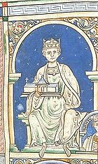 An image of King Henry II, portraying him in all white on a blue background.  King Henry is sitting, holding a church.  He has a royal crown on his head.