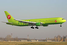 A S7 Airlines Boeing aircraft with wheels down on final approach to land