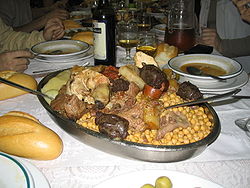 Part of a cocido serving, with chickpeas, vegetables and meat