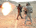 Afghan National Police officer fires an RPG round at a special mission conducted by US Army.jpg
