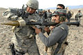 Afghan National Police officer ready to fire an RPG round at a training site.jpg